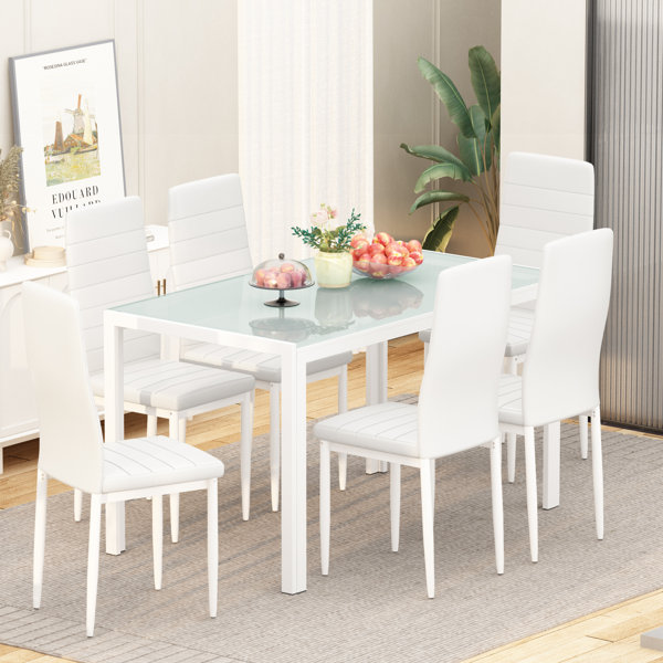 Glass table with 2024 white leather chairs